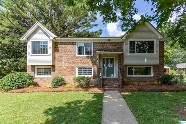 raised ranch featuring a front yard