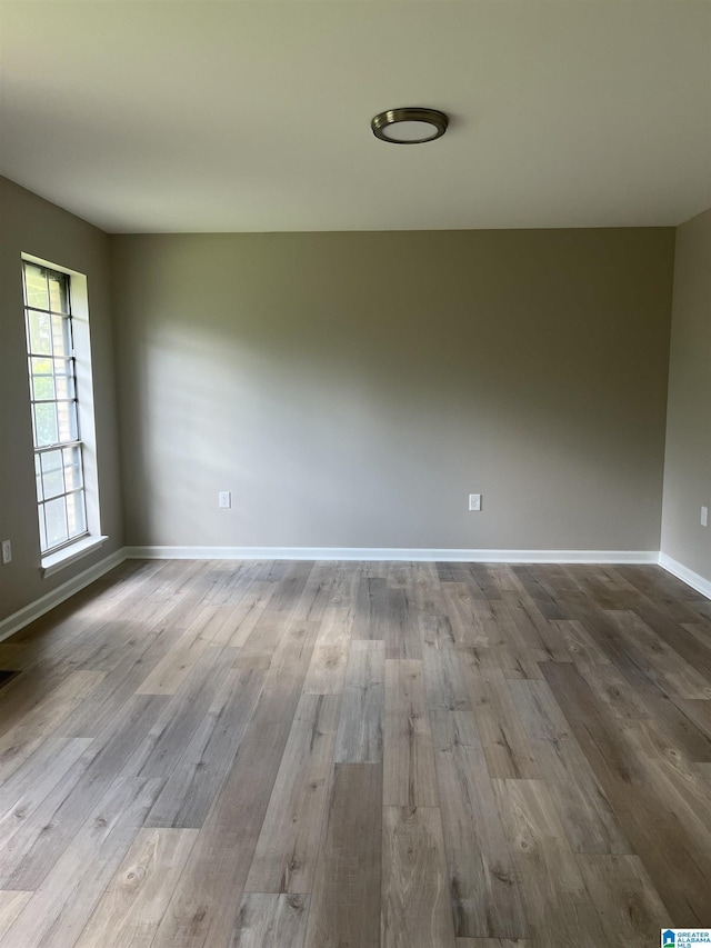 unfurnished room featuring light hardwood / wood-style floors