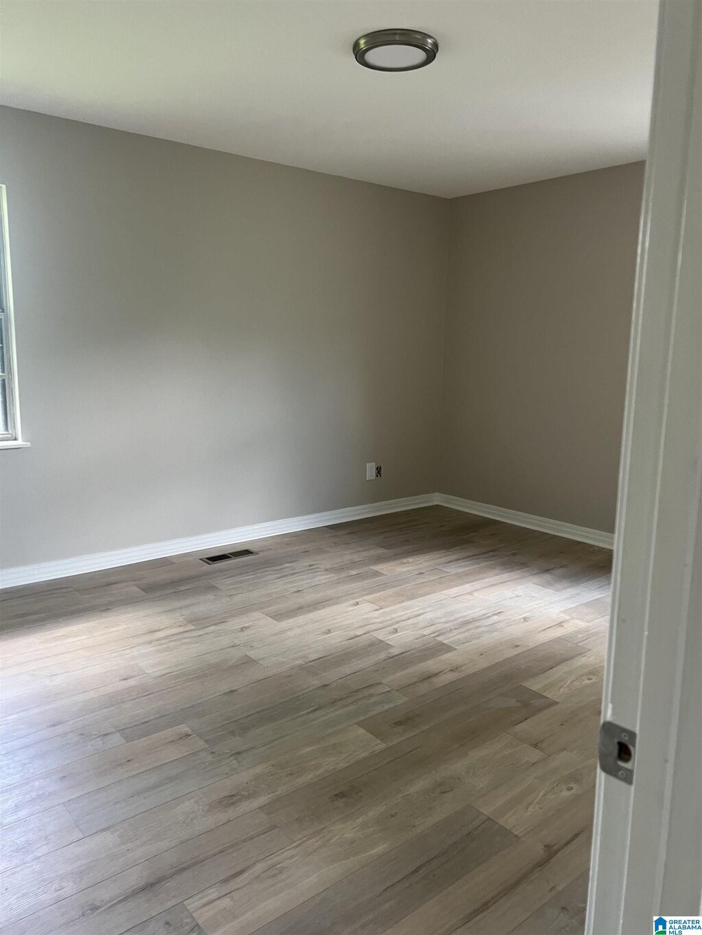 empty room featuring wood-type flooring