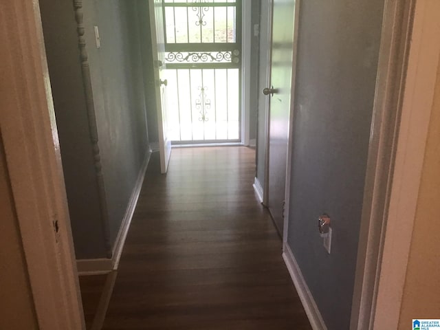 hallway featuring dark hardwood / wood-style floors