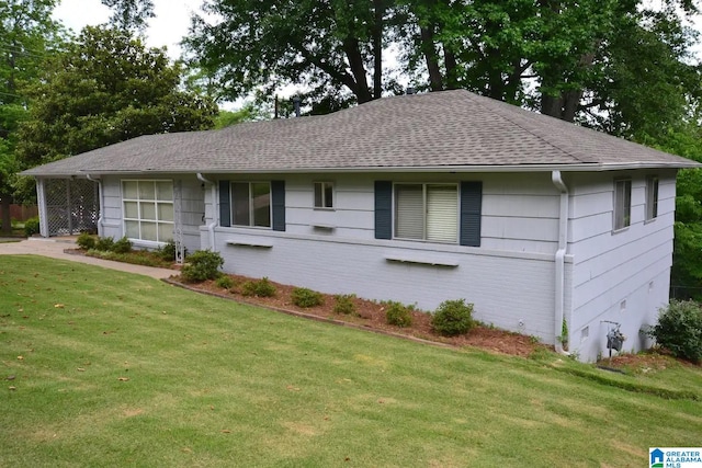 ranch-style house with a front lawn