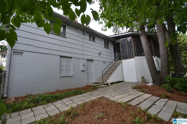 back of property featuring a sunroom