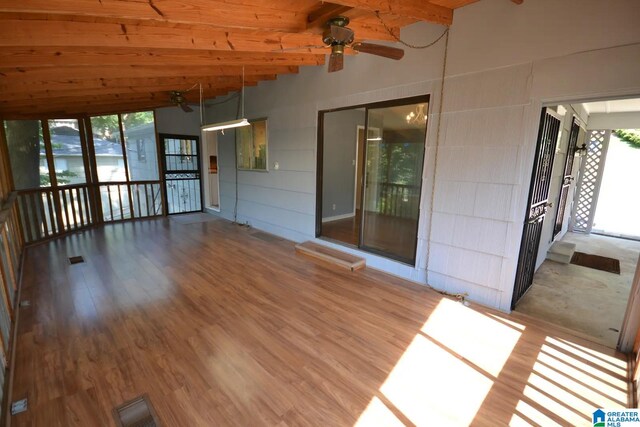 unfurnished room featuring hardwood / wood-style flooring and a healthy amount of sunlight