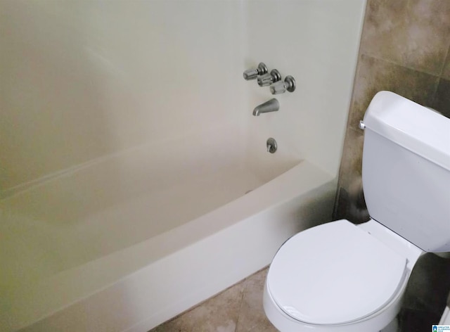 bathroom with shower / bath combination, toilet, and tile patterned flooring