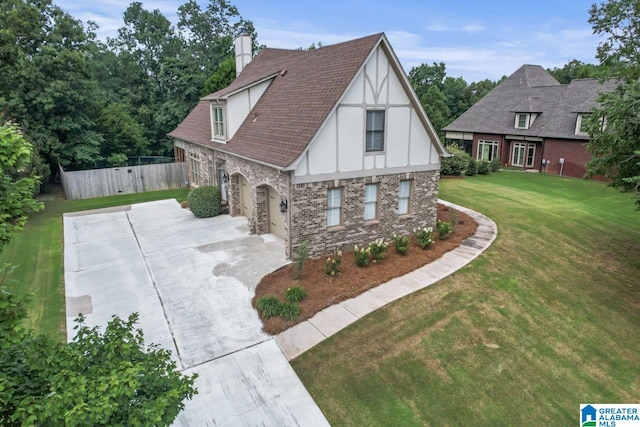 view of front of property featuring a garage and a front yard