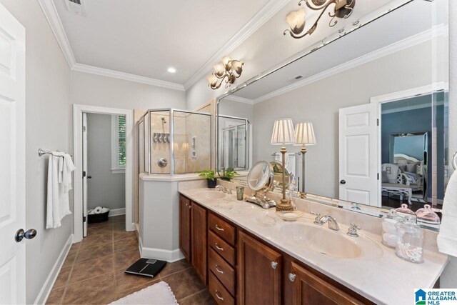 bathroom featuring tile patterned flooring, double sink vanity, crown molding, and a shower with shower door