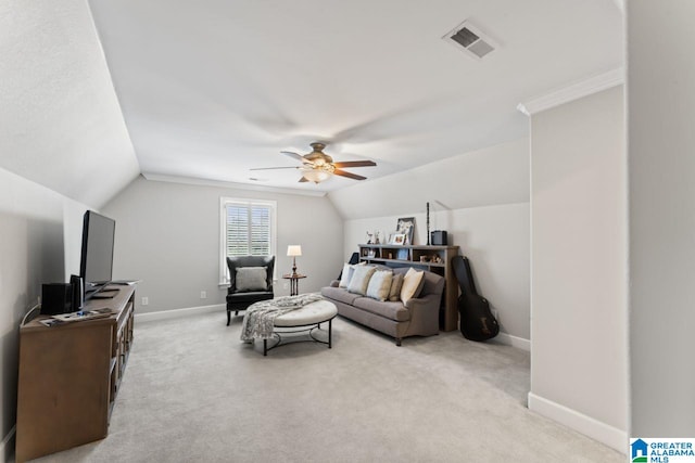 carpeted living room featuring ceiling fan and vaulted ceiling