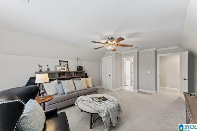 carpeted living room featuring ornamental molding, lofted ceiling, and ceiling fan