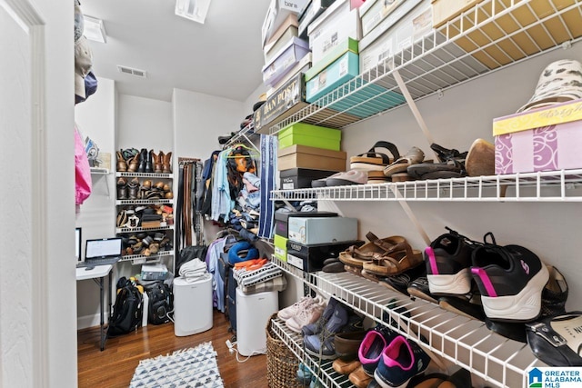 spacious closet featuring hardwood / wood-style flooring