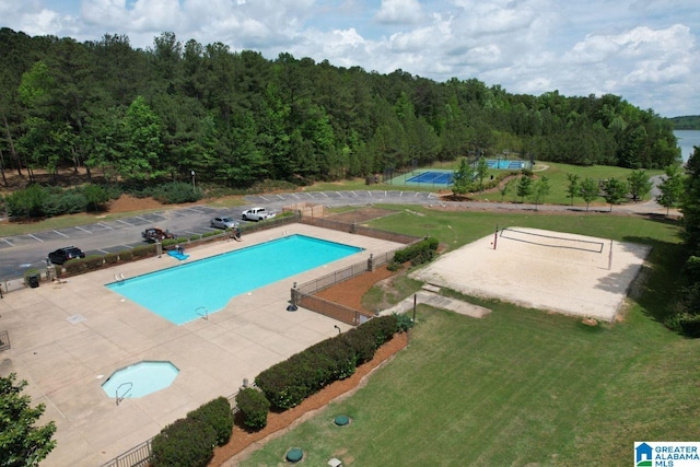 view of pool featuring a yard and volleyball court