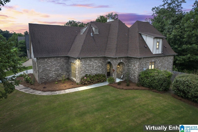 view of front of home with a lawn