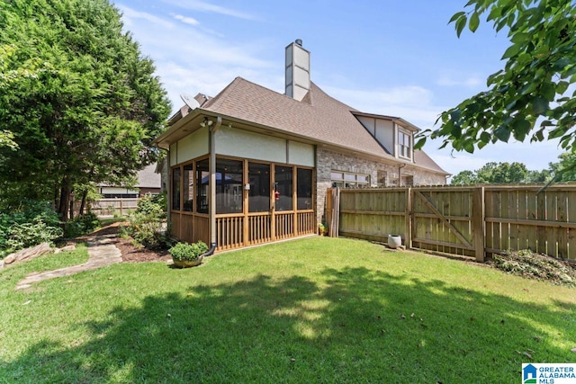 view of yard with a sunroom