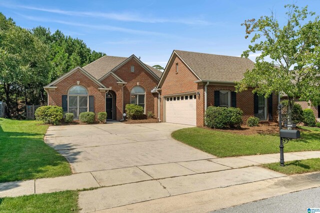 view of front of house with a garage and a front yard