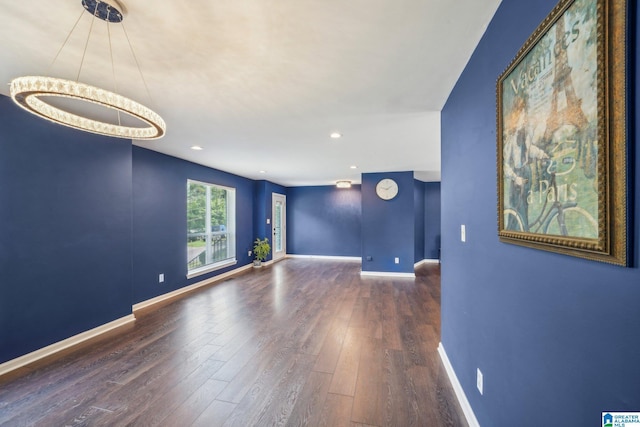 spare room featuring dark hardwood / wood-style floors