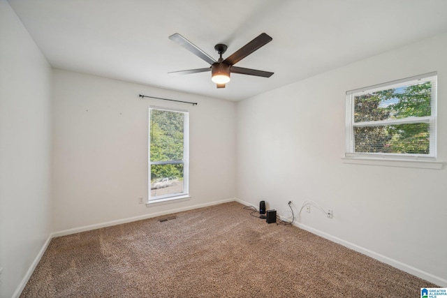 empty room with carpet floors and ceiling fan