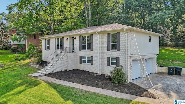 view of front of house featuring a garage and a front lawn