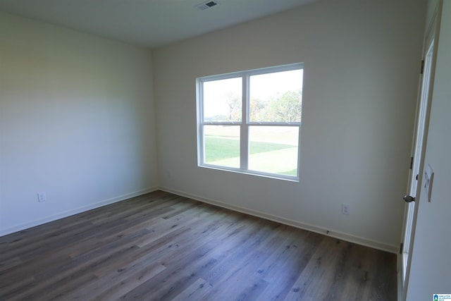 spare room with hardwood / wood-style floors