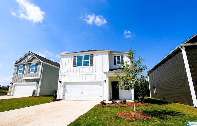 view of front of property featuring a front lawn and a garage