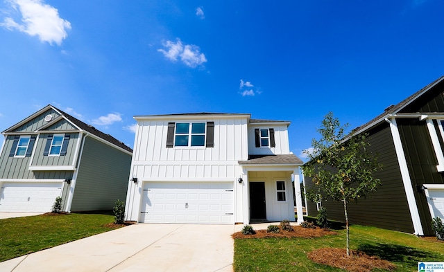 view of front of property featuring a garage and a front lawn