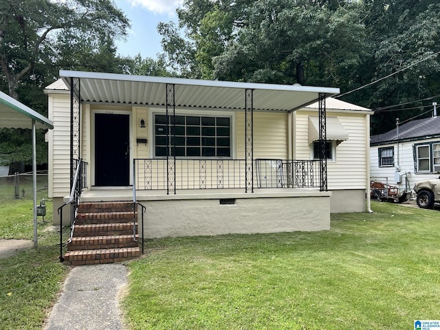 view of front of home with covered porch and a front yard