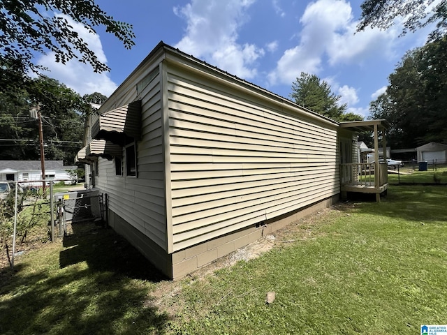 view of property exterior with a yard