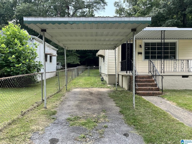 view of parking / parking lot with a yard