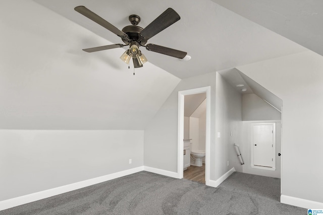 additional living space featuring carpet flooring, lofted ceiling, and ceiling fan