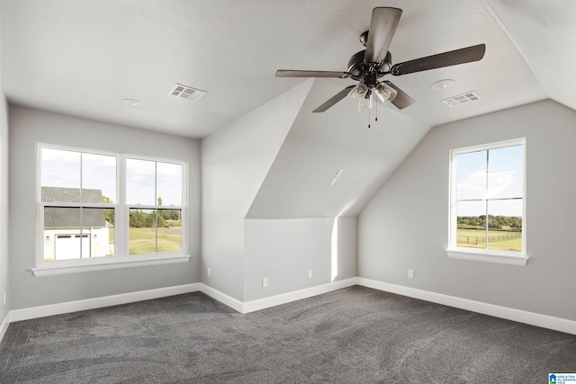 additional living space featuring carpet, ceiling fan, and vaulted ceiling