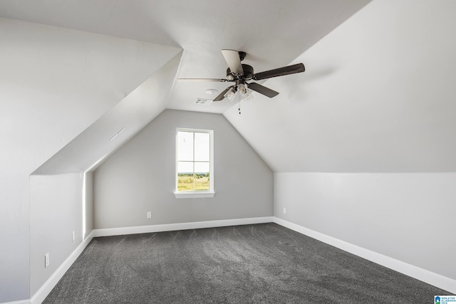 bonus room featuring ceiling fan, carpet flooring, and vaulted ceiling