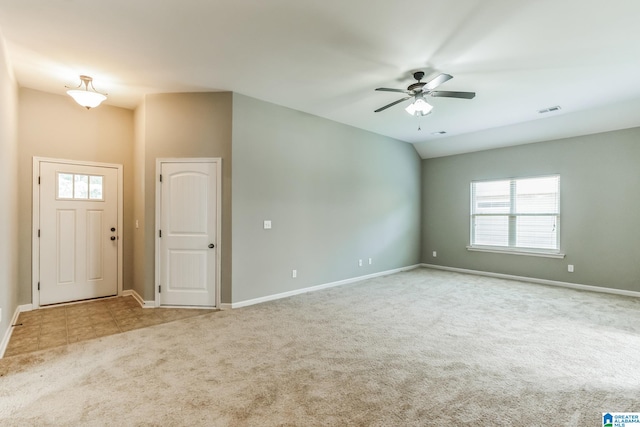 carpeted entryway featuring ceiling fan