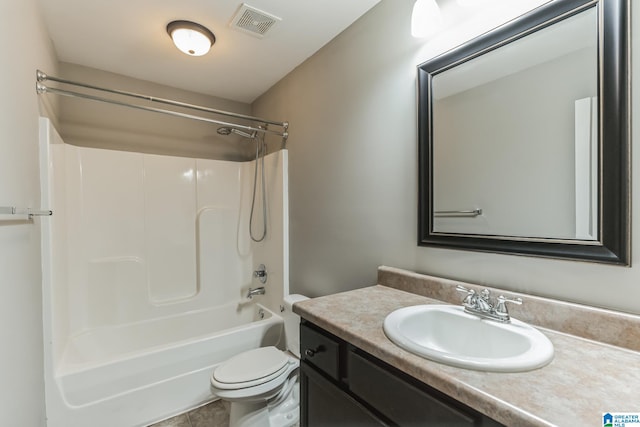 full bathroom featuring shower / washtub combination, toilet, vanity, and tile patterned flooring