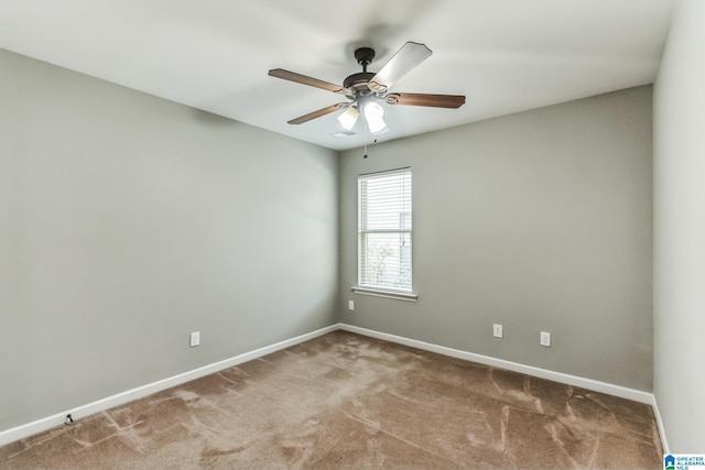 carpeted empty room with ceiling fan