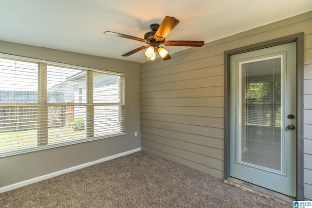 exterior space featuring ceiling fan