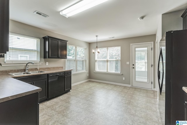 kitchen featuring black appliances, an inviting chandelier, sink, hanging light fixtures, and light tile patterned floors