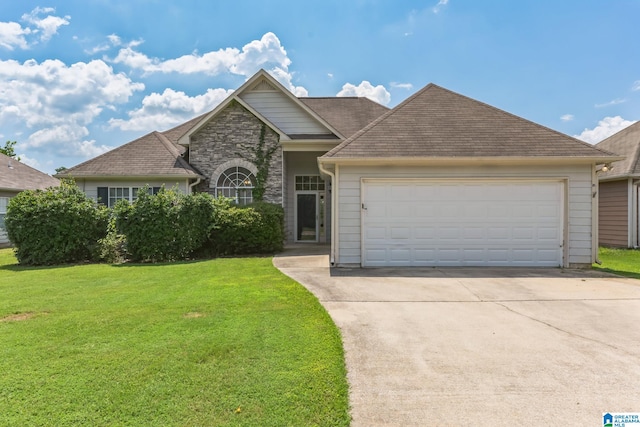 view of front of house with a garage and a front yard