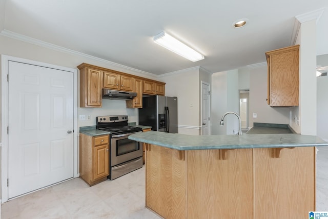 kitchen with appliances with stainless steel finishes, a breakfast bar area, sink, light tile patterned floors, and ornamental molding