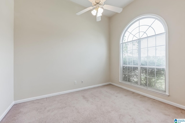 carpeted empty room with ceiling fan