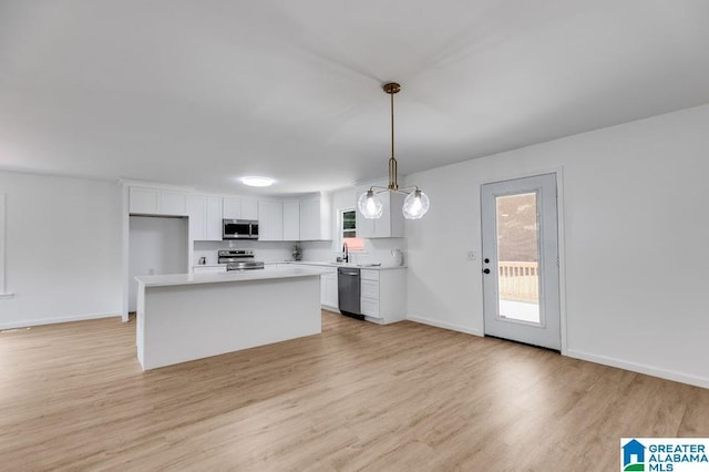 820 Boozer Rd, Heflin, AL 36264 - kitchen featuring appliances with stainless steel finishes, a sink, white cabinets, and light wood-style flooring