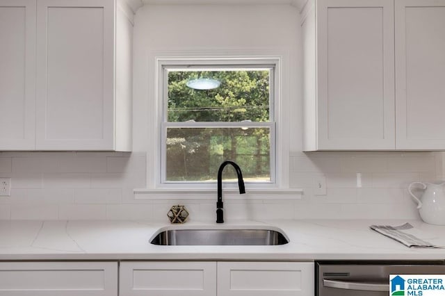820 Boozer Rd, Heflin, AL 36264 - kitchen featuring a sink, white cabinetry, dishwasher, tasteful backsplash, and light stone counters