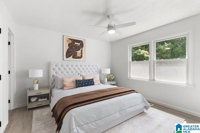 820 Boozer Rd, Heflin, AL 36264 - bedroom with light wood finished floors, baseboards, and a ceiling fan