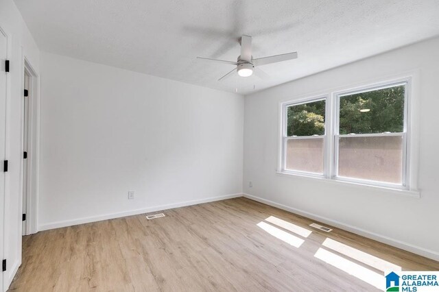 820 Boozer Rd, Heflin, AL 36264 - spare room with wood finished floors, ceiling fan, and baseboards