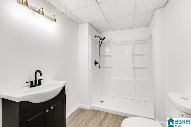 820 Boozer Rd, Heflin, AL 36264 - bathroom with toilet, wood finished floors, a shower, vanity, and a paneled ceiling