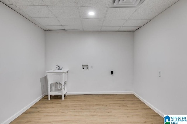 820 Boozer Rd, Heflin, AL 36264 - laundry room with light wood-style floors, washer hookup, and baseboards