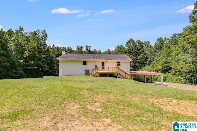 820 Boozer Rd, Heflin, AL 36264 - back of house featuring stairway, a chimney, a lawn, a wooden deck, and a detached carport