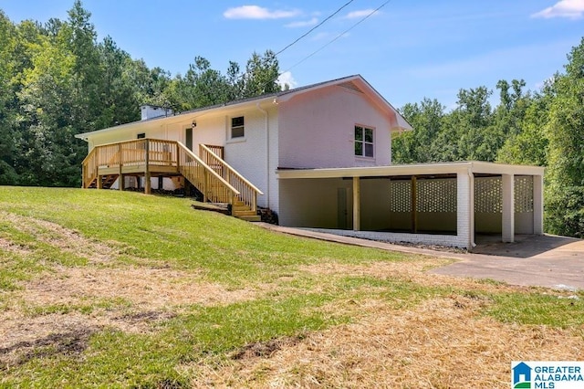 820 Boozer Rd, Heflin, AL 36264 - rear view of property featuring stairs, a lawn, a deck, and brick siding
