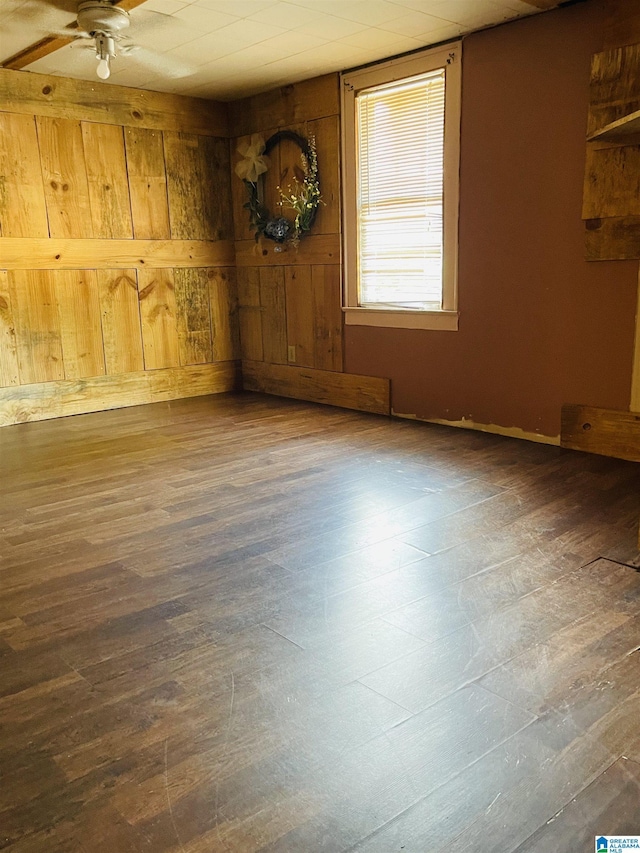 236 Shaw Ln, Sylacauga, AL 35150 - empty room with ceiling fan, wood finished floors, and wood walls