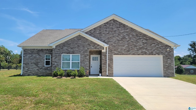 view of front of house with a front yard, concrete driveway, brick siding, and an attached garage