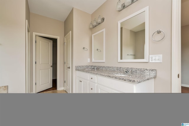 bathroom featuring vanity and hardwood / wood-style flooring