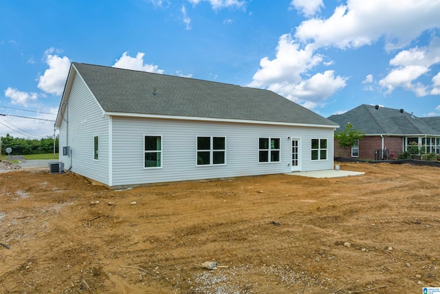 back of house featuring cooling unit