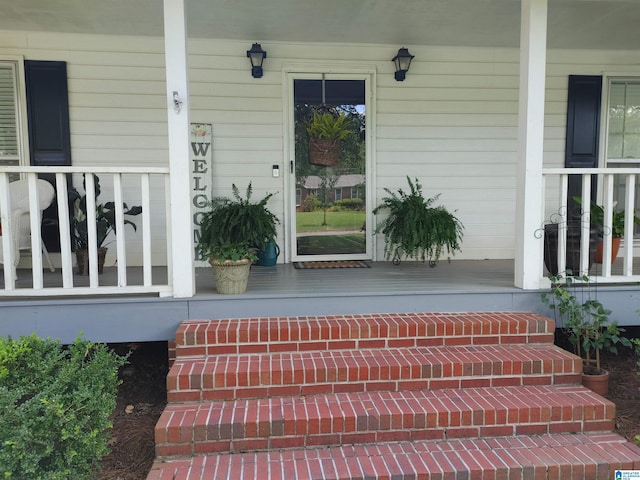 property entrance with covered porch